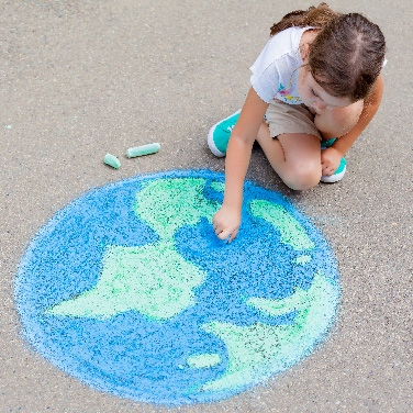 girl drawing on the ground